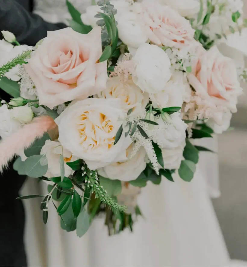 Photo of bride holding flowers